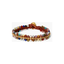 Woven bracelet featuring turquoise, amethyst, iolite, moonstone, carnelian, lapis, green garnet, aquamarine and jasper with 18K gold plated sterling silver
