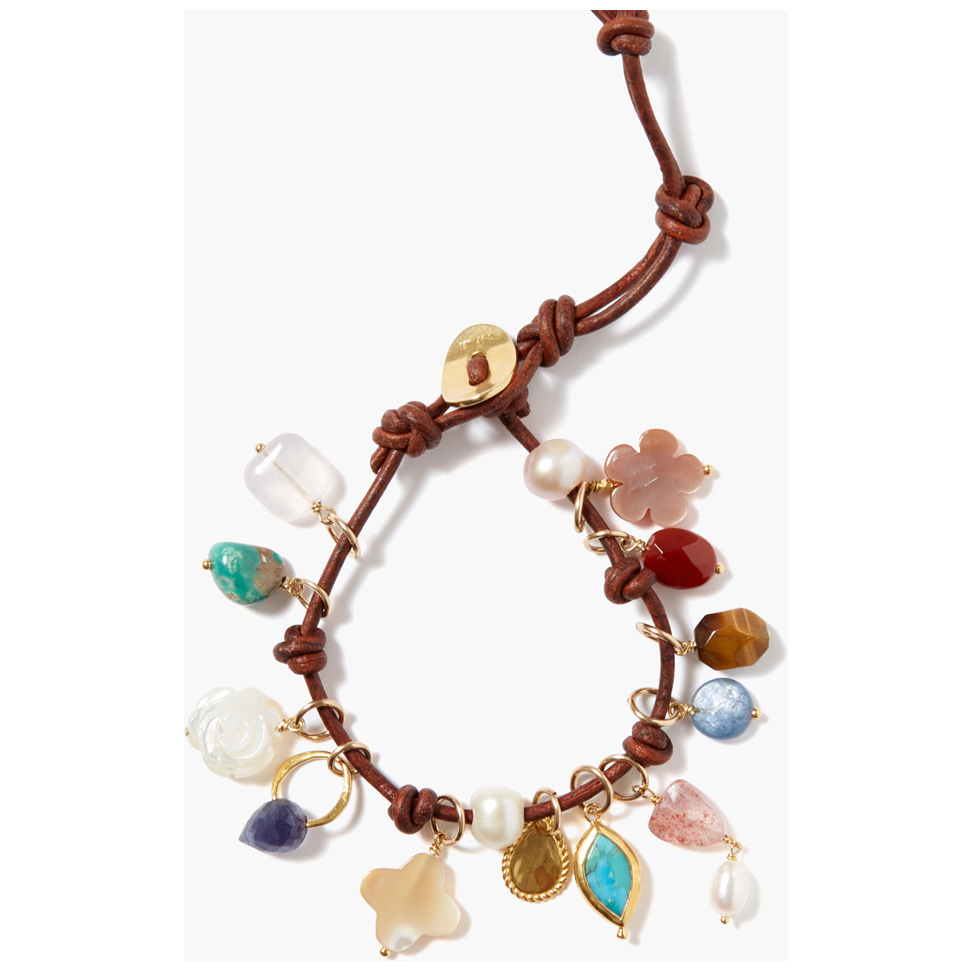 Leather charm bracelet featuring mother of pearl, carnelian, quartz, kyanite, freshwater pearl, iolite and turquoise