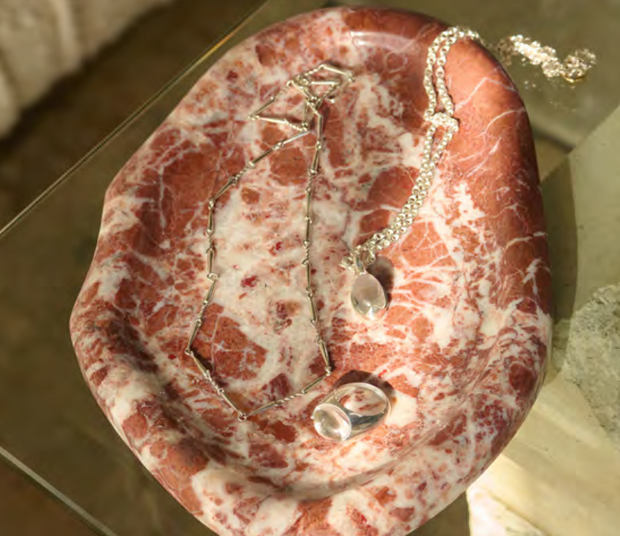 Melt Tray with silver necklaces displayed on Rosso Leggero Marble tray, 240x170x18 mm, Mined France.